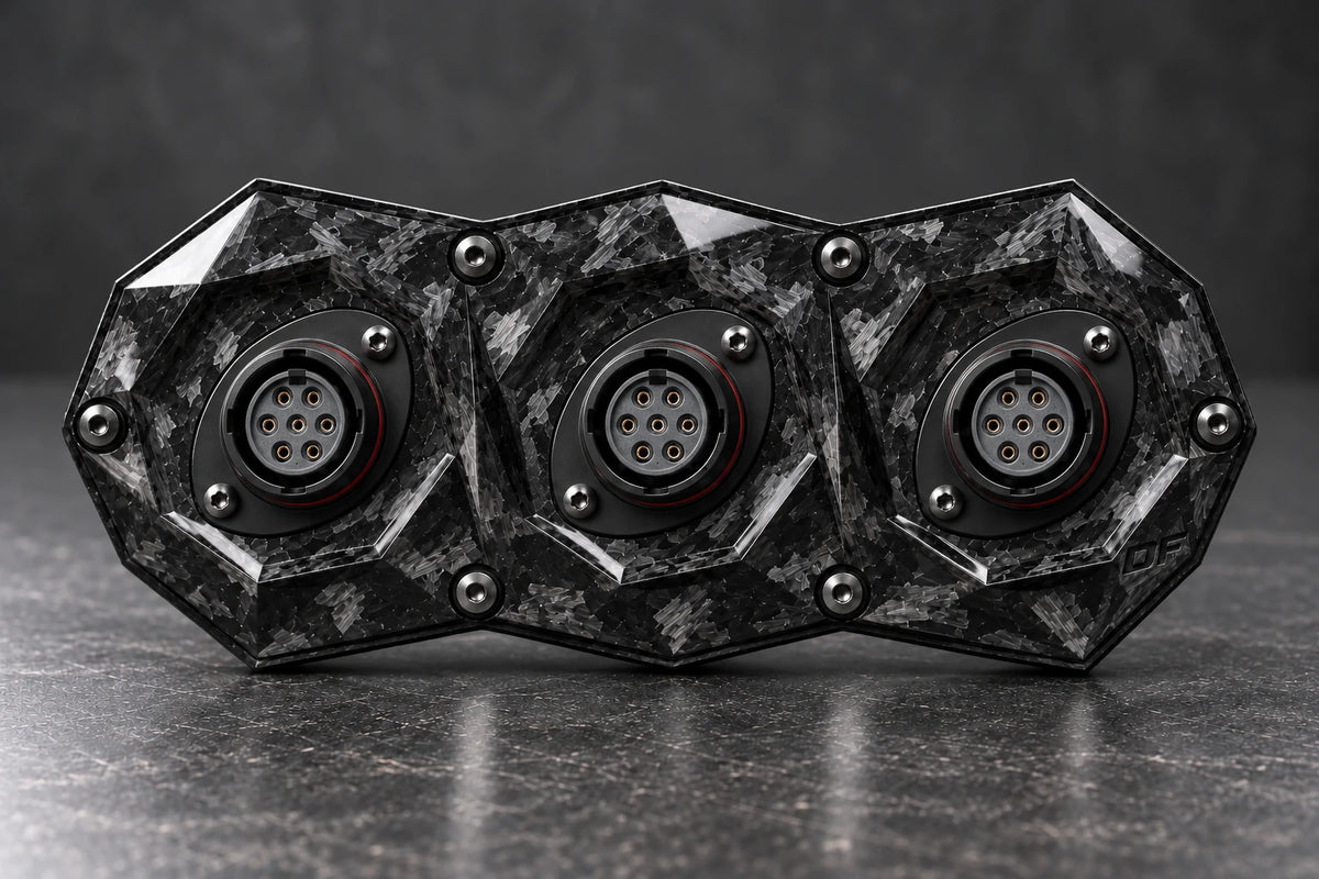 Dorifab compact triple forged carbon bulkhead connector plate, front view. Illustrative connector installation; connectors not included.
