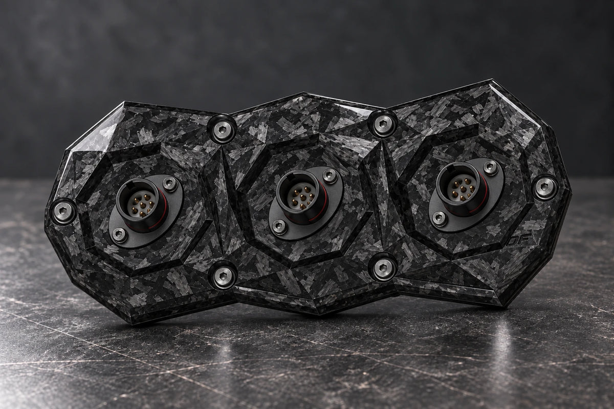Dorifab compact triple forged carbon bulkhead connector plate, hero view. Illustrative connector installation; connectors not included.