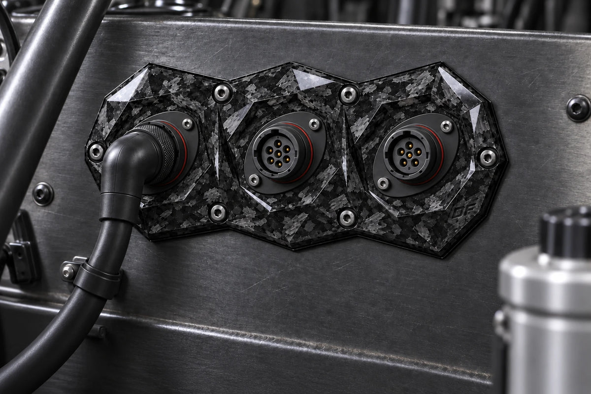 Dorifab compact triple forged carbon bulkhead connector plate, installed view. Illustrative connector installation; connectors not included.