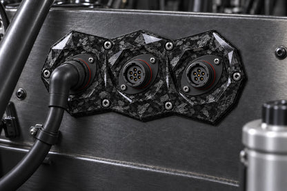 Dorifab compact triple forged carbon bulkhead connector plate, installed view. Illustrative connector installation; connectors not included.