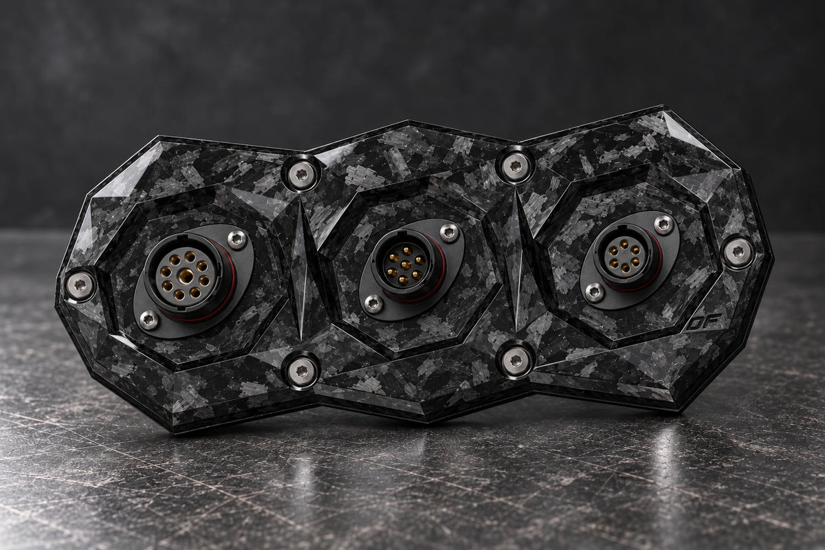 Dorifab compact triple forged carbon bulkhead connector plate, mixed shell sizes view. Illustrative connector installation; connectors not included.