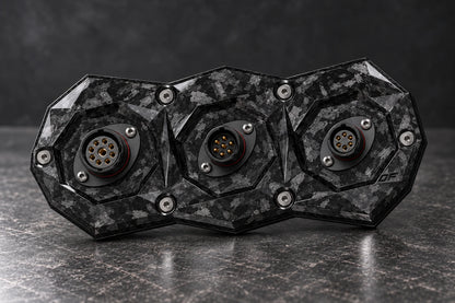 Dorifab compact triple forged carbon bulkhead connector plate, mixed shell sizes view. Illustrative connector installation; connectors not included.