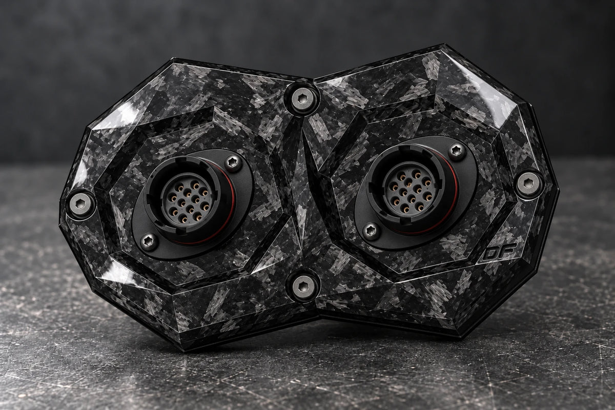 Dorifab medium dual forged carbon bulkhead connector plate, hero view. Illustrative connector installation; connectors not included.