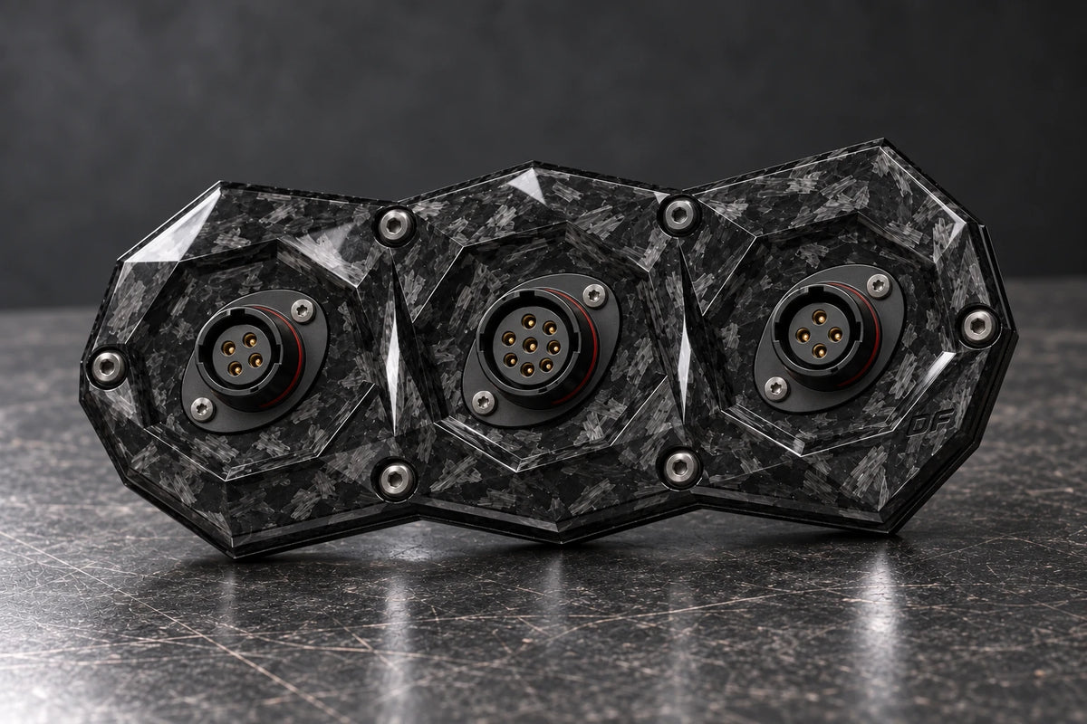 Dorifab medium triple forged carbon bulkhead connector plate, alternating shell sizes view. Illustrative connector installation; connectors not included.