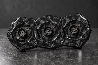 Dorifab medium triple forged carbon bulkhead connector plate, hero view. Illustrative connector installation; connectors not included.