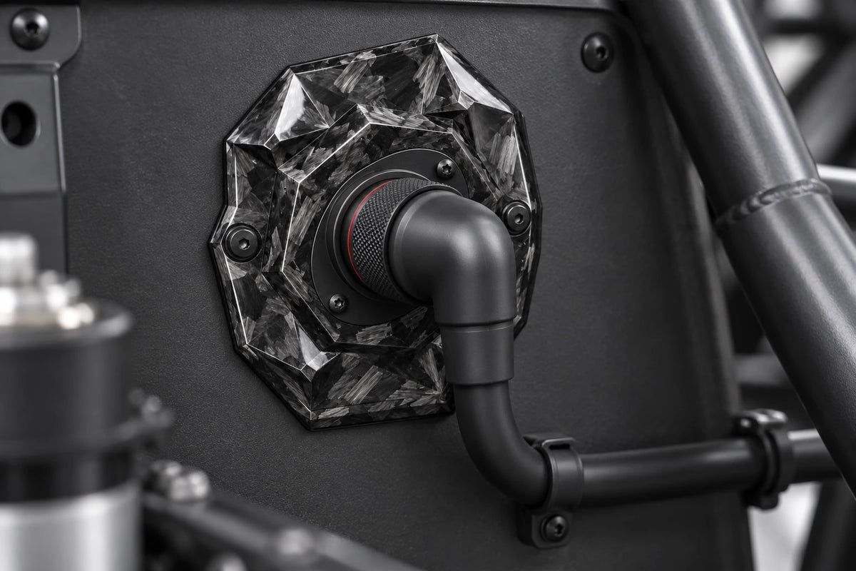 Large Dorifab single left forged carbon bulkhead plate installed on a motorsport firewall with a booted DR25 loom.
