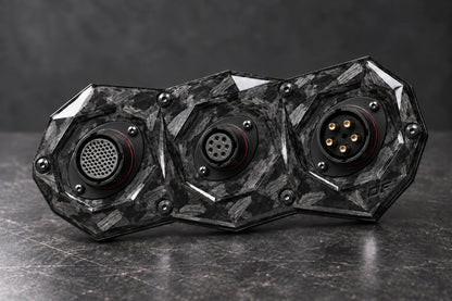 Large Dorifab triple forged carbon bulkhead plate with large-small-large connector shells and varied contact layouts.