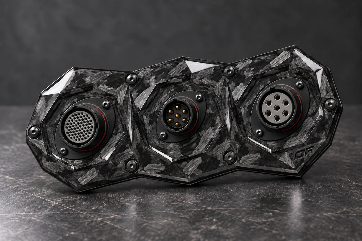 Large Dorifab triple forged carbon bulkhead plate with different connector shell sizes and illustrative contact layouts.